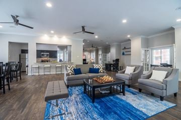 Dallas apartment for rent - a living room with couches and chairs and a coffee table