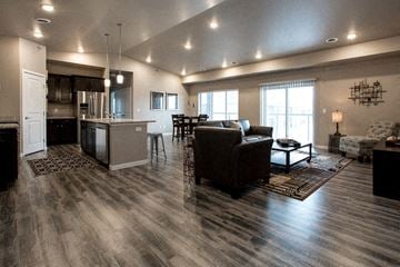 Fargo townhouse for rent - a living room and kitchen with a couch and a table