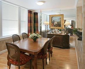 Richmond condo for rent - a dining room with a wooden table and chairs