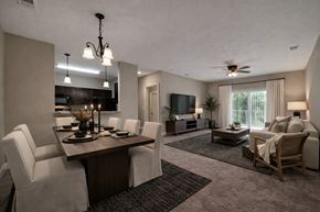Lincoln apartment for rent - A well-lit, modern dining room with a wooden table and chairs.