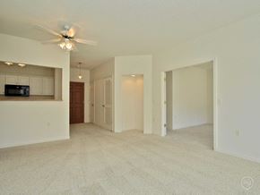 Lincoln apartment for rent - A spacious living room with a ceiling fan and carpeted floor.