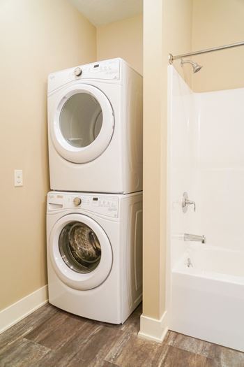 Full-size washer and dryer in each apartment*