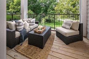 Bellevue apartment for rent - A patio with two couches and a coffee table.