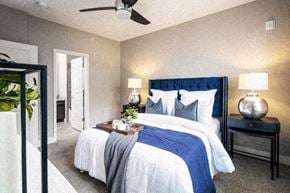 Bellevue apartment for rent - A bedroom with a bed, nightstand, and ceiling fan.