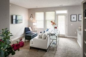 Bellevue apartment for rent - A living room with a sofa, a coffee table, and a vase of flowers.