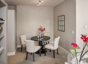 Bellevue apartment for rent - A dining room with a round table and chairs.