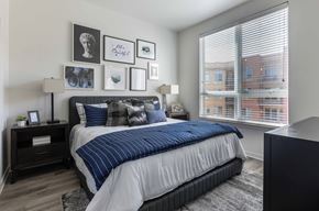 Boulder apartment for rent - a bedroom with a bed and a large window