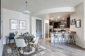 Boulder apartment for rent - a dining room and kitchen area with a table and chairs