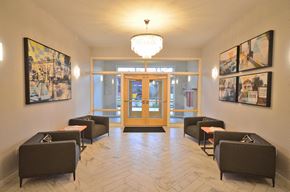 Seattle apartment for rent - the lobby of a building with chairs and a chandelier