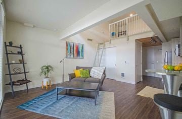 Seattle apartment for rent - a living room with a couch and a table  and a staircase