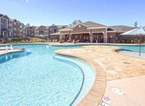 Clayton apartment for rent - a large swimming pool with a building in the background
