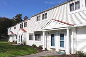 Clarks Summit townhouse for rent - a white building with white siding and a sidewalk