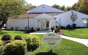 Clarks Summit townhouse for rent - a white house with a yard sign in front of it