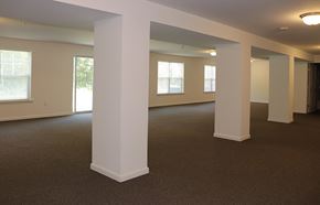 Clarks Summit townhouse for rent - an empty living room with pillars and windows