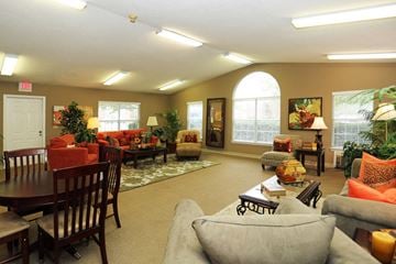 Portsmouth apartment for rent - a living room with couches and chairs and a table