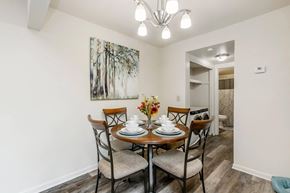 Blacksburg apartment for rent - a dining room with a table and chairs and a chandelier