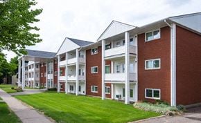 Brandon apartment for rent - a row of brick and white apartment buildings