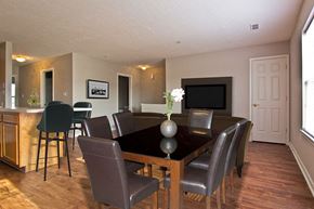 York apartment for rent - a dining room with a table and chairs
