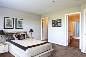 York apartment for rent - a bedroom with a bed and a door to a bathroom
