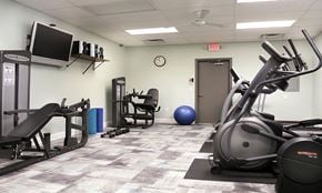 York apartment for rent - a gym with exercise equipment and a tv