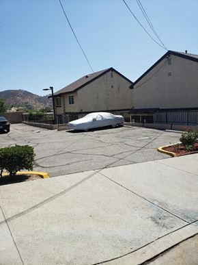 Los Angeles apartment for rent - a car is parked in a parking lot