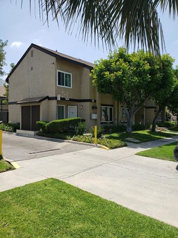 Los Angeles apartment for rent - a house with a sidewalk and a tree in front of it