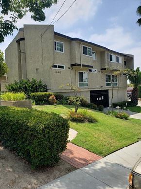 Los Angeles apartment for rent - a house with a lawn and bushes in front of it