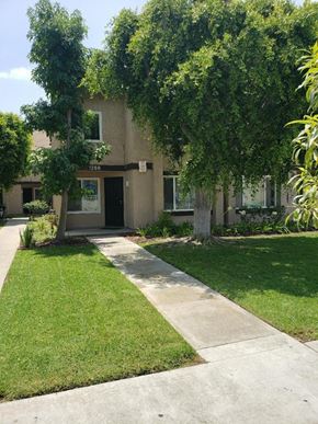 Los Angeles apartment for rent - a house with a lawn and trees in front of it