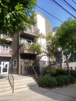 Los Angeles apartment for rent - an apartment building with stairs and trees in front of it