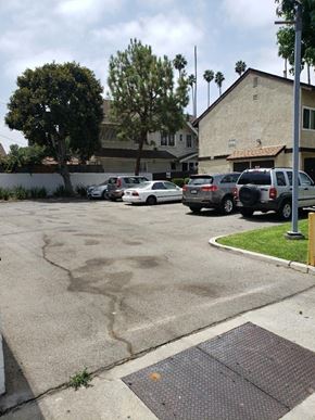 Los Angeles apartment for rent - a parking lot with cars parked in it
