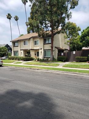 Los Angeles apartment for rent - a house on the corner of a street with palm trees