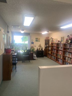 Los Angeles apartment for rent - a library with stacks of books and a table with chairs