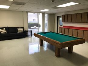 Reseda apartment for rent - a pool table in a room with a couch