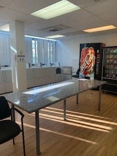 Los Angeles apartment for rent - a dining room with a table and a coke machine