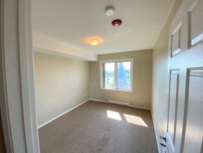Brandon apartment for rent - a empty room with a window and a door