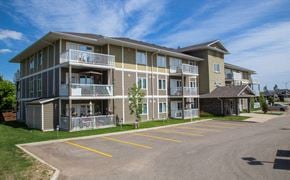 Brandon apartment for rent - a large apartment building with balconies and a parking lot