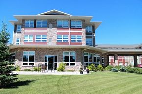 Brandon apartment for rent - a large building with a lawn in front of it