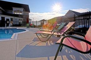 Staunton apartment for rent - a group of beach chairs sitting next to a pool