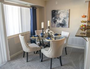 Schaumburg apartment for rent - a dining room with a glass table and chairs