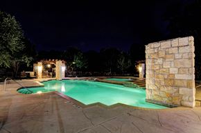 Houston apartment for rent - the swimming pool at night at the resort at night