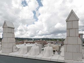 Spokane apartment for rent - a group of white statues on the roof of a building