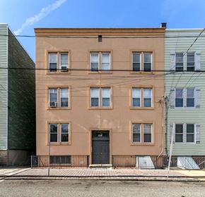 Jersey City apartment for rent - a brown building with a black door and