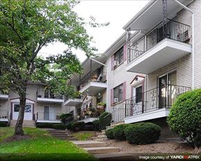 North Plainfield apartment for rent - A tree is in front of a white building with a balcony.