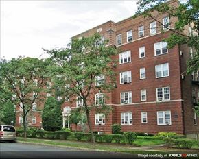 Montclair apartment for rent - A brick building with trees in front of it.