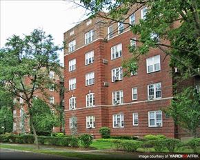 Montclair apartment for rent - A red brick building with many windows and trees in front.