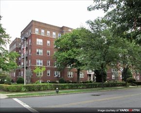 Montclair apartment for rent - A red brick building with trees in front.