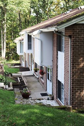 Scranton apartment for rent - a brick house with a sidewalk in front of it
