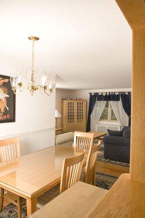 Fair Lawn triplex for rent - A dining room with a wooden table and chairs.