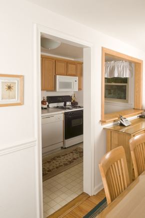Fair Lawn triplex for rent - A kitchen with a white fridge and a microwave on top of it.
