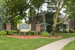 Fair Lawn triplex for rent - A sign that says Fairway Park Estates in front of a building.